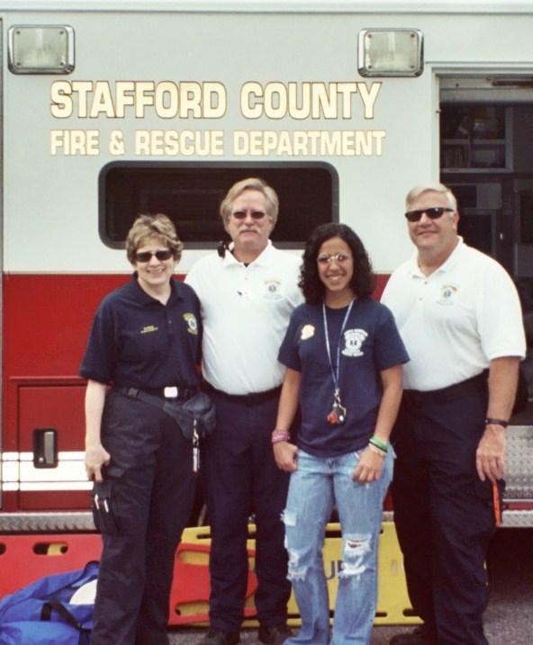 Chris Schoon, Lynn Platt, Marie Lo Duco and Bob Zink set up for fall festival