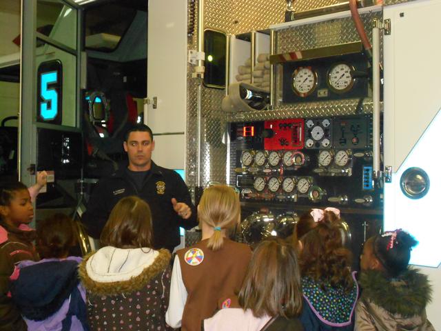 Lt. Brian Thompson talks with the scouts about fire safety. Feb 2012