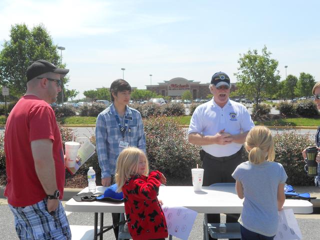 Recue Chief Lynn Platt instructs the children on the Heimlich Maneuver for relieving an obstruction from a choking victim. SYHFL 2012