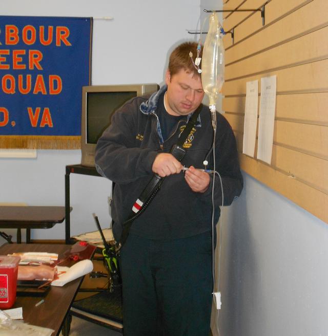 Matt King adjusting the IV fluids for the IV station
March Taining 2013