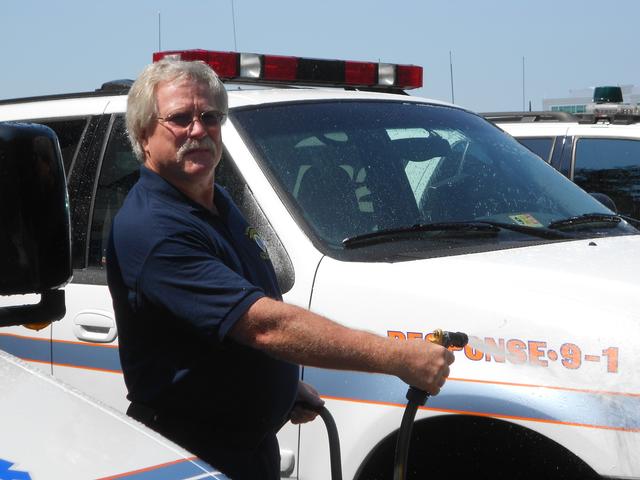 Rescue Chief Lynn Platt washing Response vehicle for Fall Festival. Sept. 2013