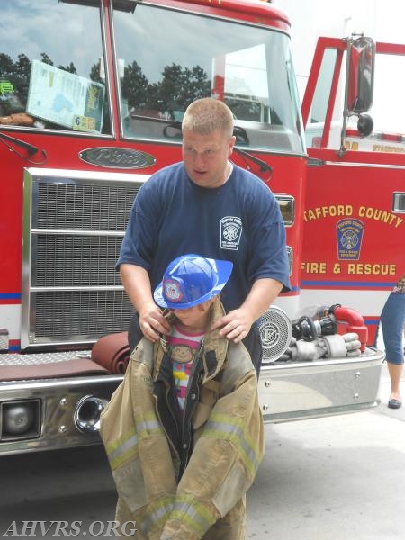 Firefighter Matt King with new junior
Anniversary Open House 2014