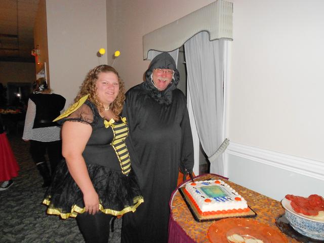 President Angela Wilhelm and Rescue Chief Lynn Platt prepare to cut the cut at Squad Banquet 2011