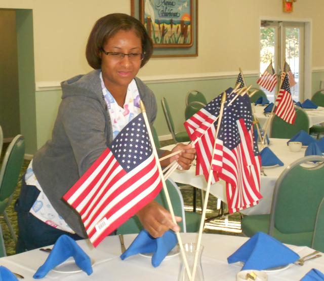 Ericka Daley helps decorate for the night.