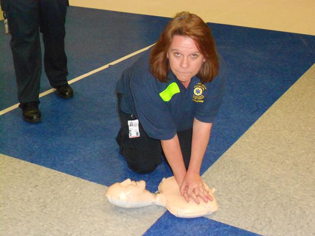 Roxanne Dunn Demenstrates Chest compressions Barrett ES Health Fair