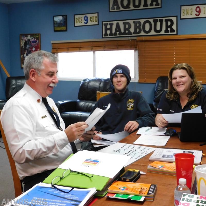 Chief Dunn with Luke and 
Angela studying for Hazmat Operations class